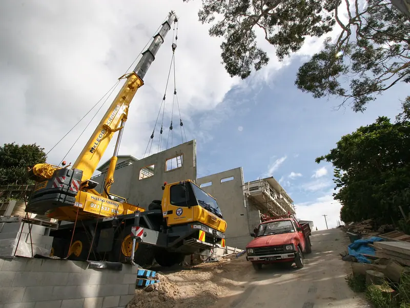 All-terrain crane with its outriggers set and boom extended